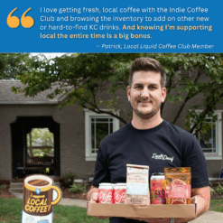 photo of a man holding a box of beverages including coffee beans, beer and more. he is outside in front of his house with a yard sign that says i support local coffee. on the top of the graphic has a quote that says 